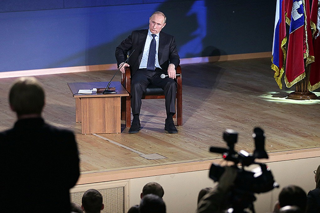 Vladimir Putin takes questions from an audience at Moscow State University. Putin said that Russia should beef up its presence in the Arctic. Photo: AP