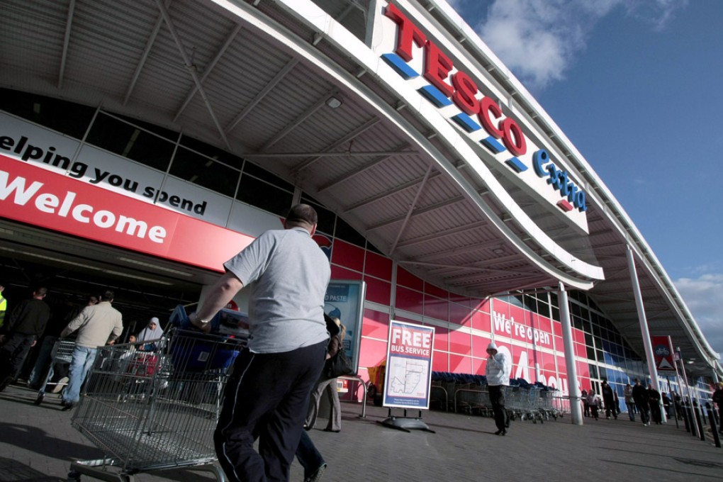 Customers enter a Tesco store in Newcastle.
