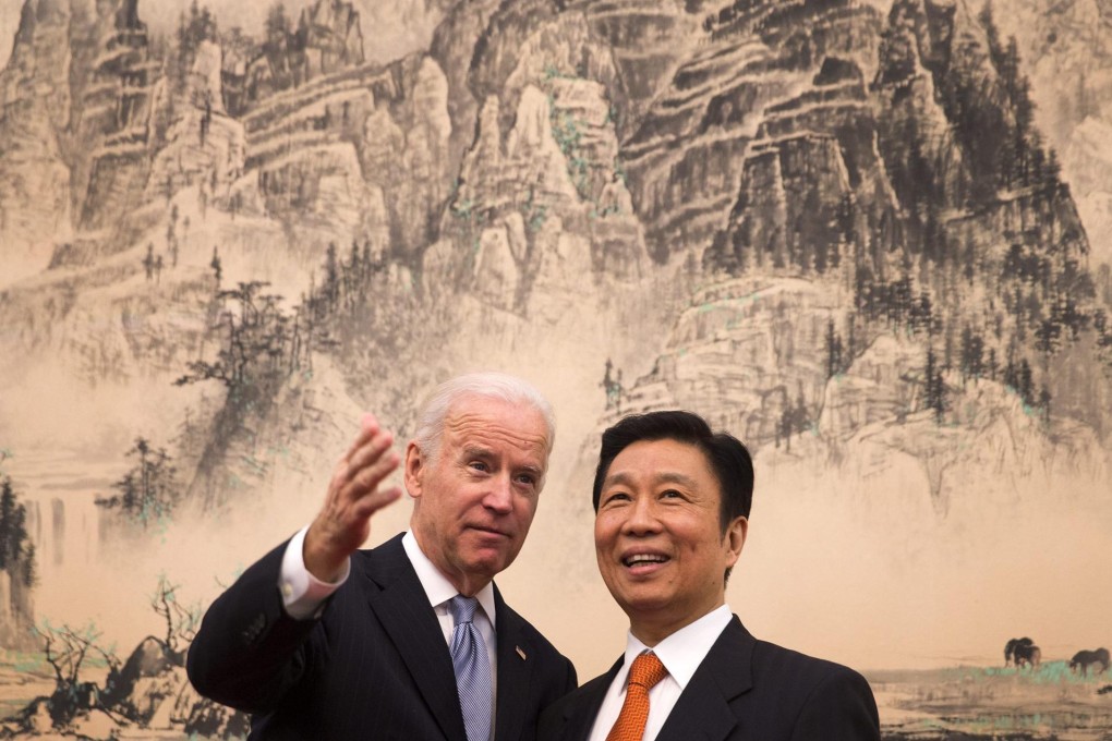 Joe Biden chats with Vice-President Li Yuanchao during his visit to Beijing. Photo: EPA