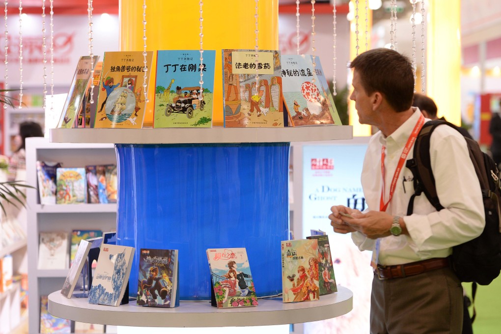 A visitor looks at a book exhibition at a Shanghai book fair. Photo: Xinhua