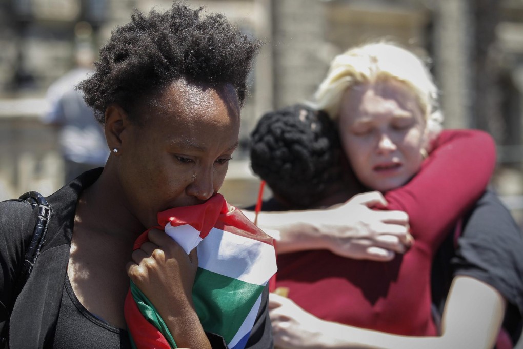 South African mourners weep in front of Cape Town city hall - the site of Mandela's first speech after he was released. Photo: EPA