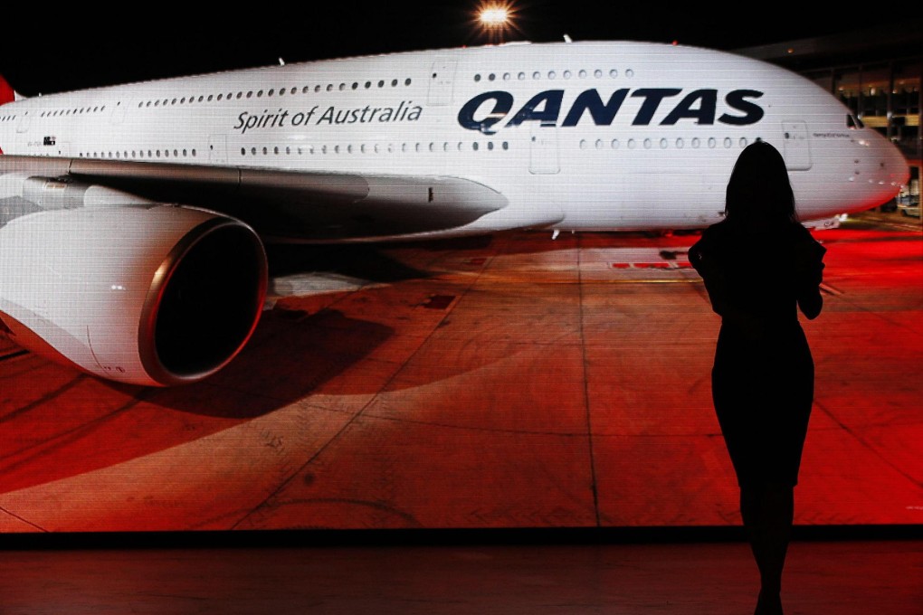 Qantas says it will review its capital spending plans, freeze executive pay and look for other ways to cut costs. Photo: Reuters