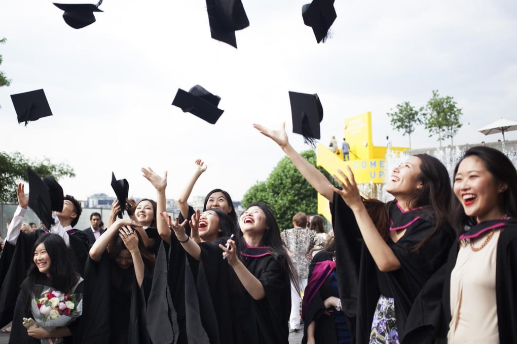 Students from the University of the Arts London celebrate after their graduation ceremony.