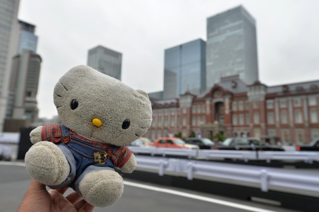 Sonoe Azuma holds a toy during a day out in Tokyo. Photo: AFP