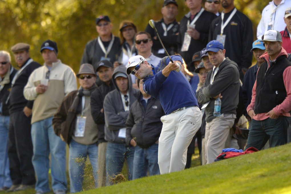 Zach Johnson makes his approach shot on the 18th hole during the first round of the World Challenge tournament at Sherwood Country Club in California. Photo: AP