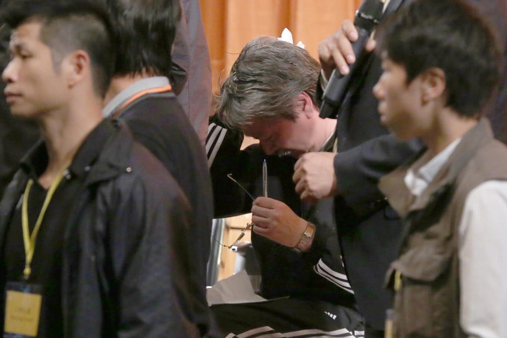 John Tsang after he was hit by an egg. Photo: SCMP