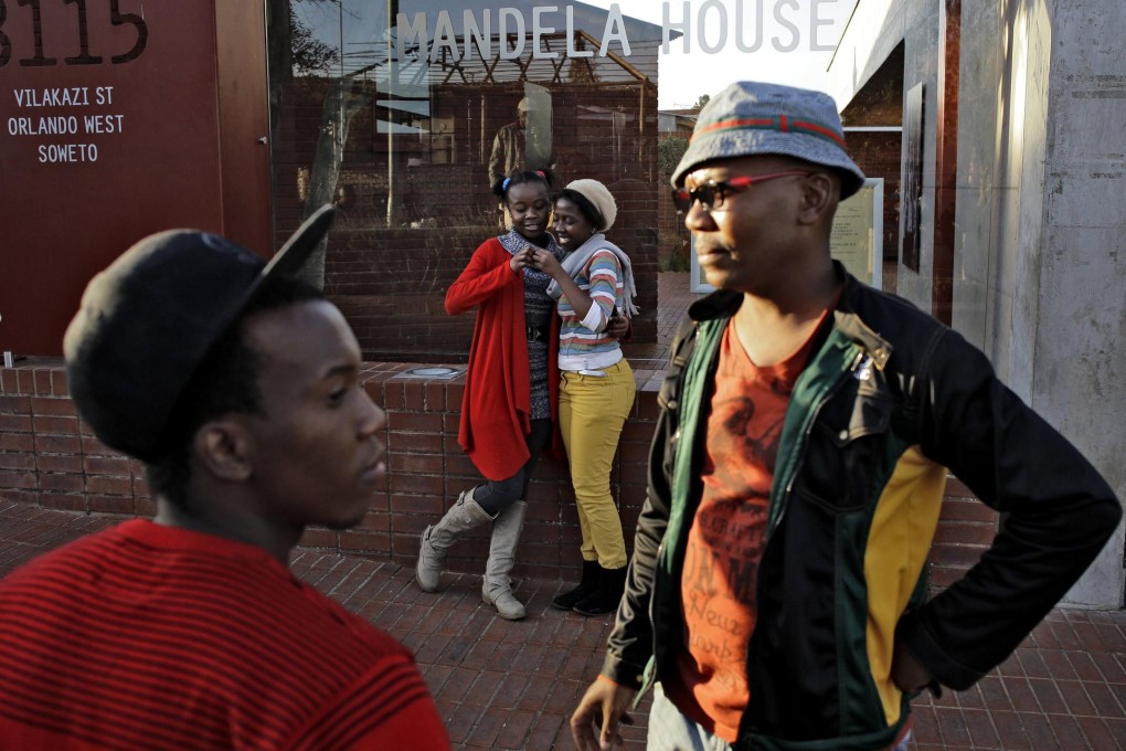 Young people at Soweto's Nelson Mandela National Museum in June. They hope his inspiration can help the country move on. Photo: Reuters