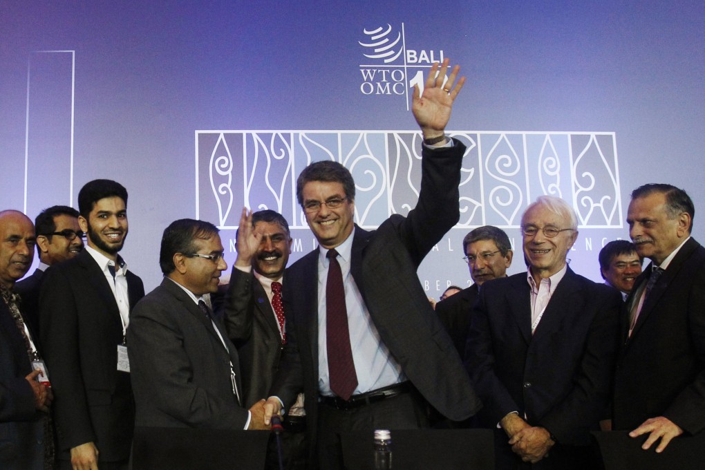 Director-General Azevedo gestures as he is congratulated by delegates after the closing ceremony of the ninth WTO Ministerial Conference in Nusa Dua. Photo: Reuters