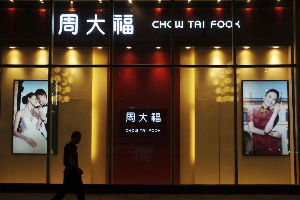 A man walks past a Chow Tai Fook shop in Yichang, Hubei province. Photo: Reuters