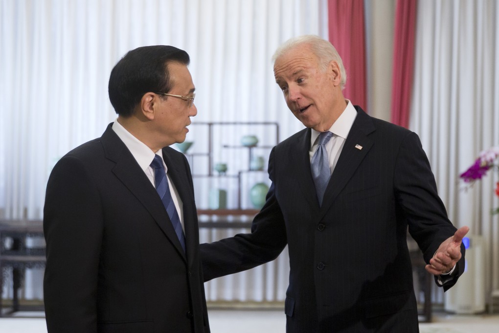 US Vice-President Joe Biden (right) chats with Chinese Premier Li Keqiang in Beijing on Thursday. Photo: AP