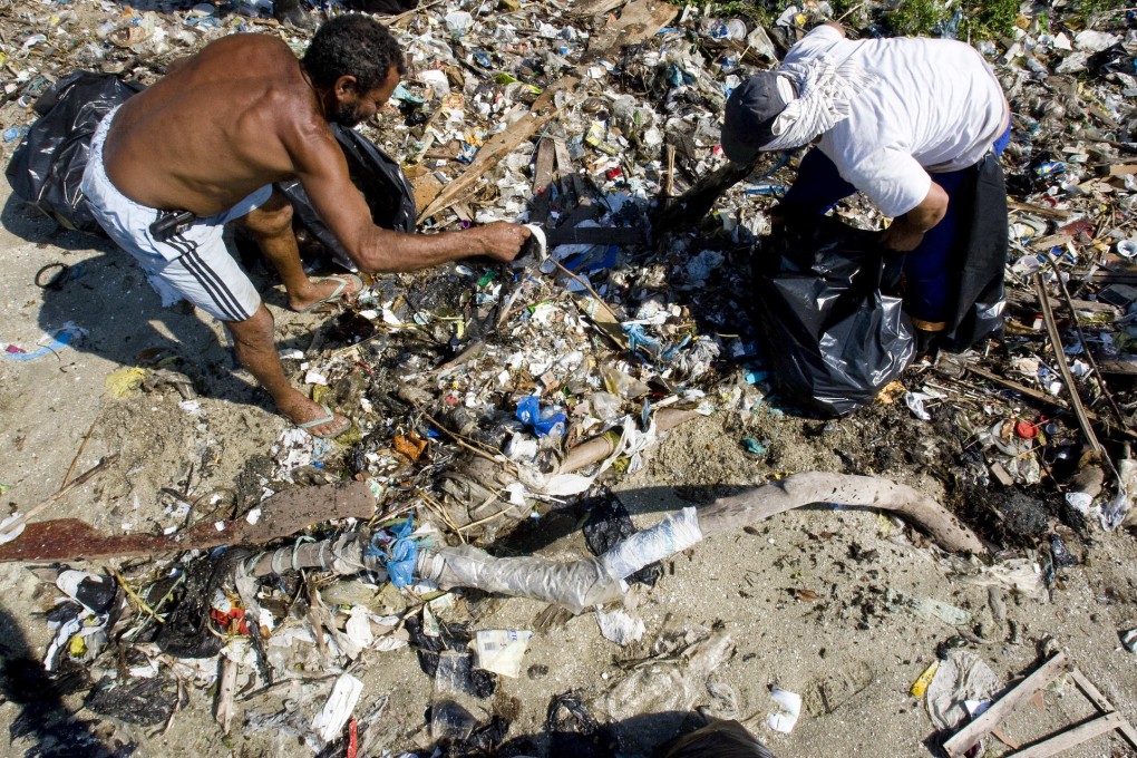 Plastic waste accumulated on a beach in Brazil. Tiny bits of such waste can be ingested by marine worms, harming their health. Photo: AFP
