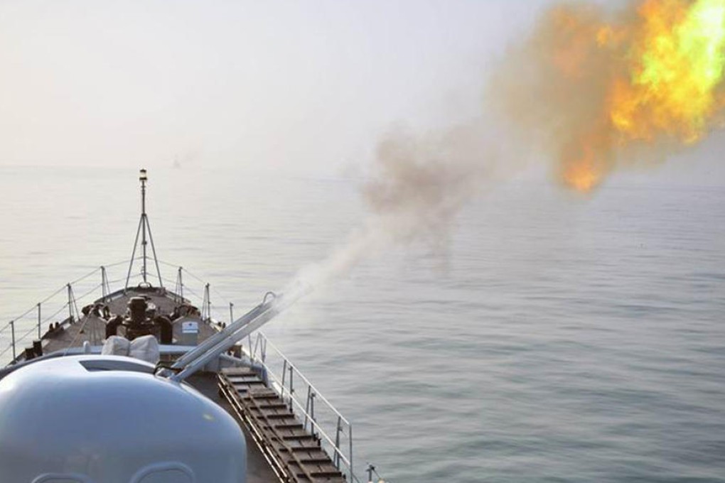A ship gun fires during last month's exercises. Photo: SCMP