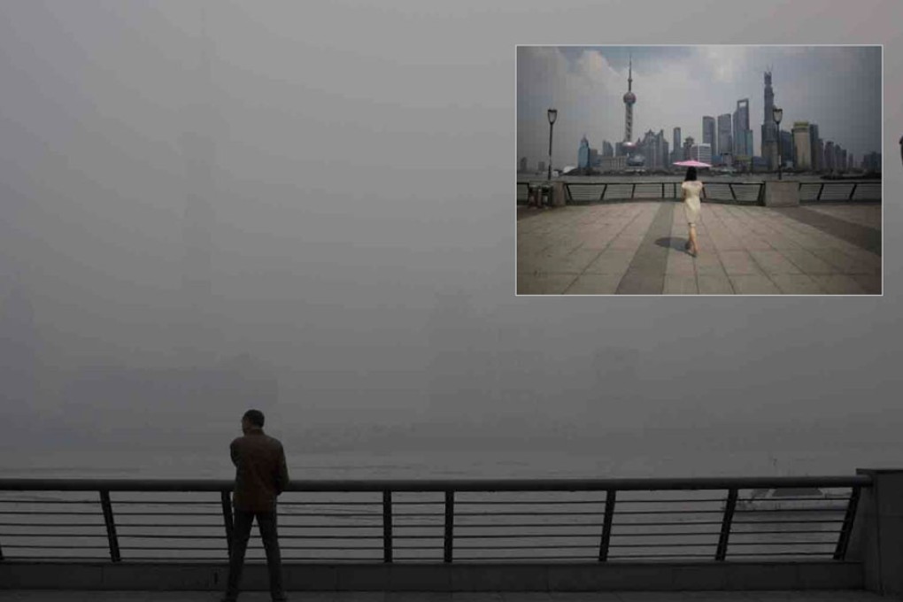 A man sees very little as he gazes across from the Bund to the skyscrapers of Pudong, Shanghai’s financial district. Photos: Reuters, AP