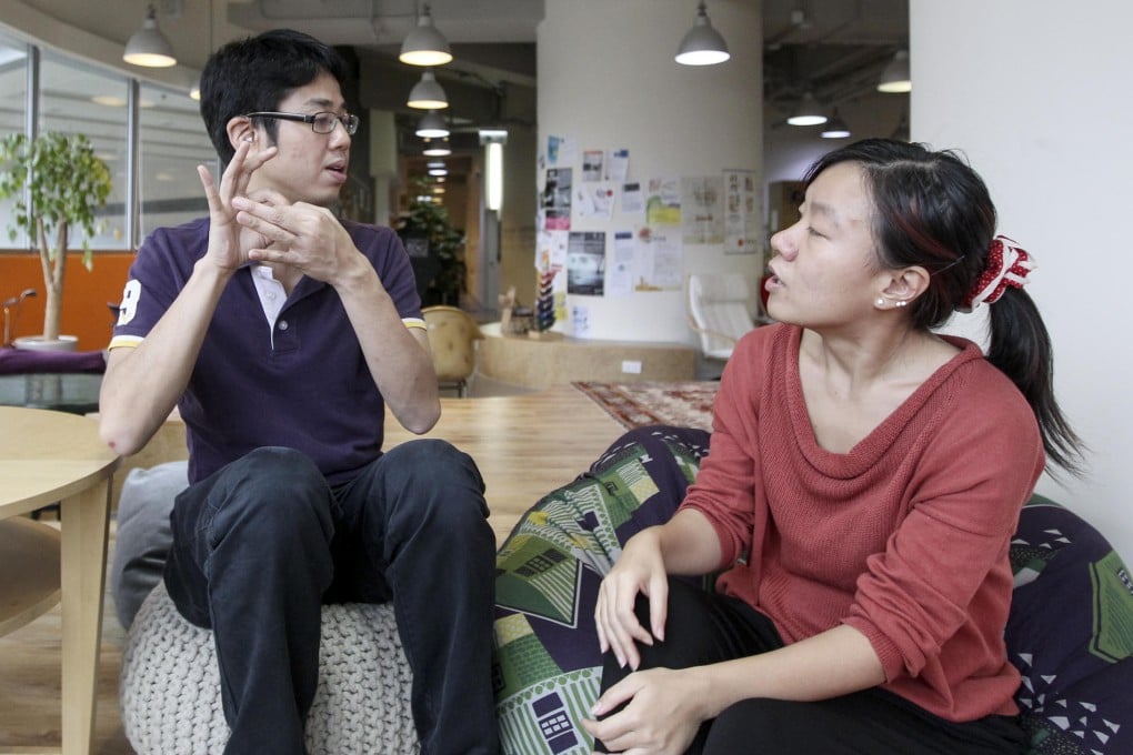 Sign interpreter Chan Yi-hin and William Tang. Photo: Jonathan Wong