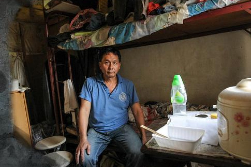 Hung Yiu-wah in his subdivided Sham Shui Po flat. Photo: Edmond So