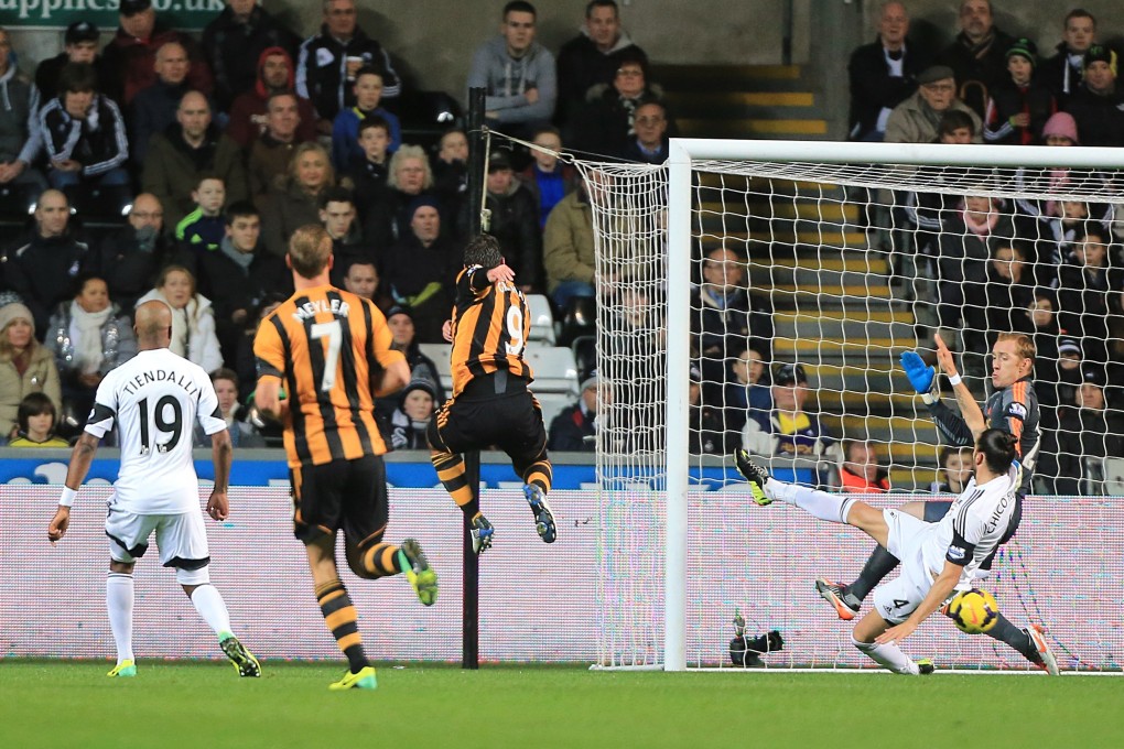 Danny Graham scores Hull City's team's opening goal in the draw against Swansea at Liberty Stadium in Swansea. Photo: AP