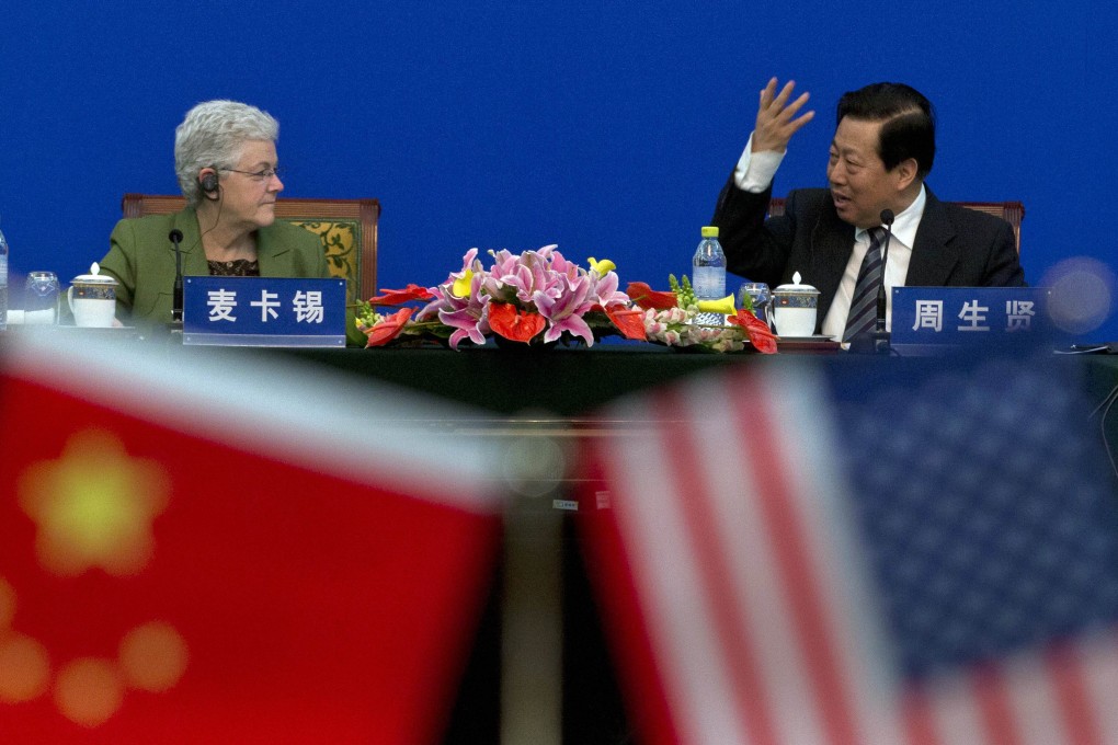 US Environment Protection Administrator Gina McCarthy with Chinese Environmental Protection Minister Zhou Shengxian chats in Beijing on Monday. Photo: AFP