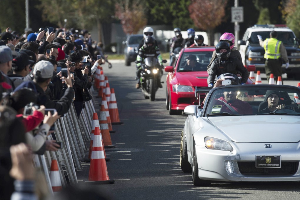 Fans of actor Paul Walker take part in a car cruise at a memorial rally in Valencia, California. Photo: Xinhua