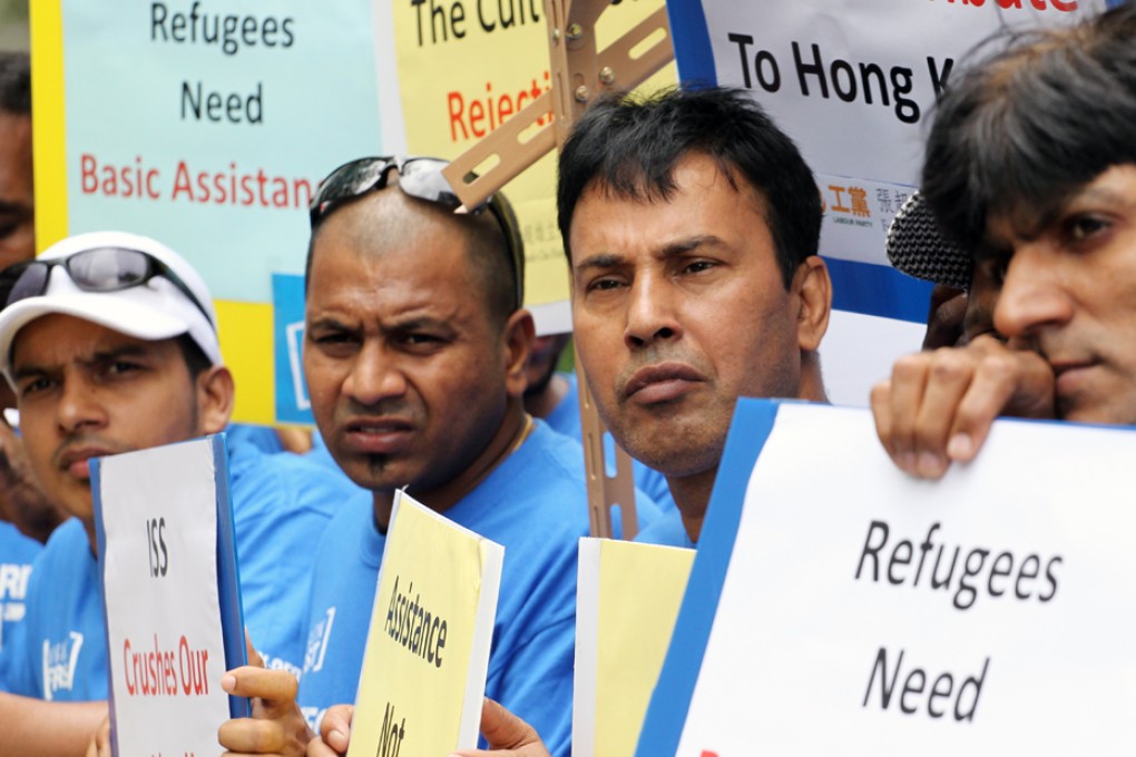 A group of refugees protest outside Legislative Council in Tamar which is against the city's poor treatment to refugees. Photo: Felix Wong