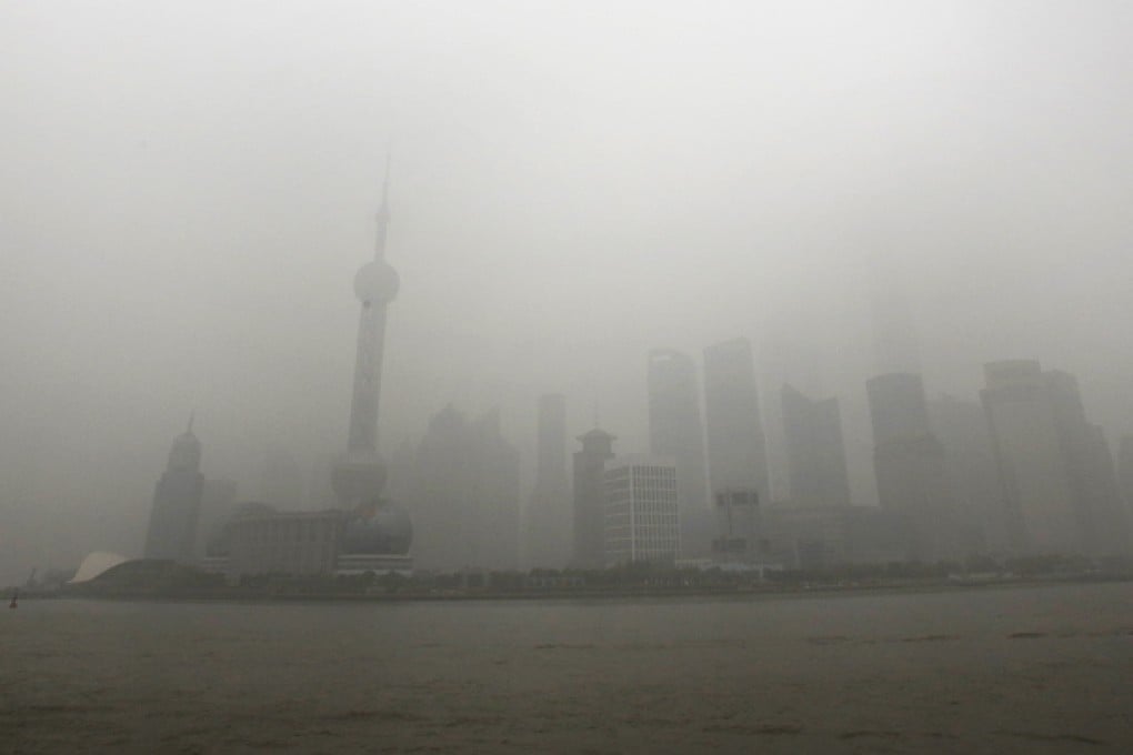 The skyline of Shanghai's Financial District covered with heavy smog on Monday. Photo: AP