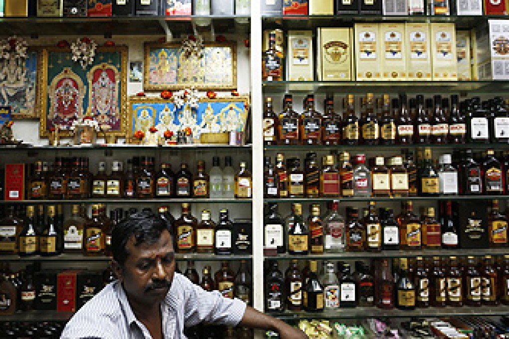 A ban on sales of alcohol, seen as a contributory factor in last Sunday's riot, will come into force in Little India this weekend. Photo: EPA