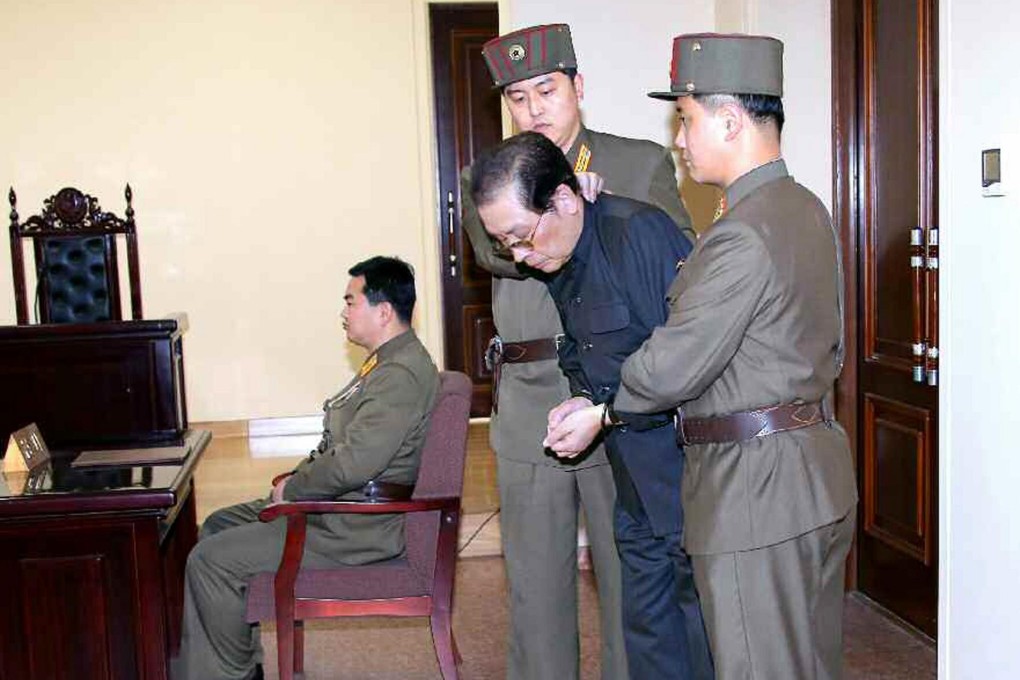 Jang Song-thaek is dragged out of a special military court on Thursday. He was executed soon after. Photo: AFP