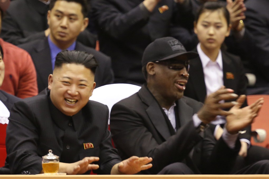 Kim Jong-un (left) and Dennis Rodman (right) watch North Korean and US players during an exhibition basketball game in Pyongyang in February. Photo: AP