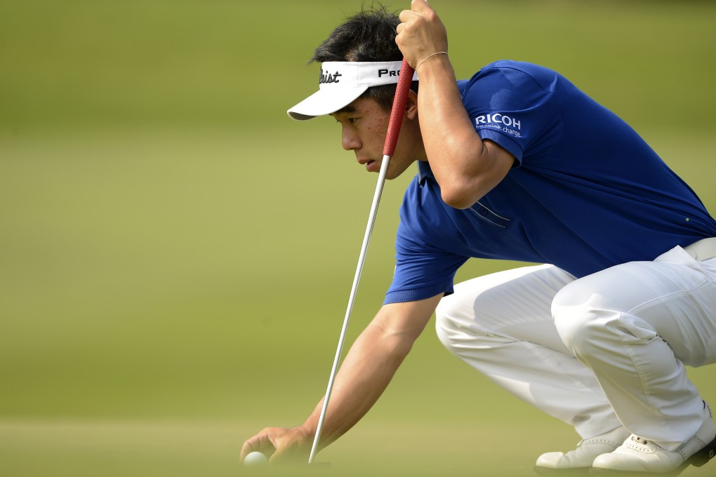 Arnond Vongvanij of Thailand lines up a putt on the first day of the Thai Golf Championship at the Amata Spring Country Club in Chonburi, outside Bangkok. Photo: AFP