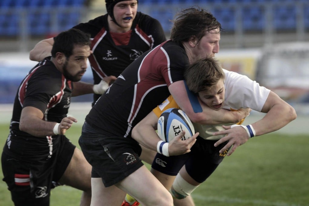 A member of the 'Moufflons' is tackled as he drives for the line in an international against Austria last month. Photo: AFP
