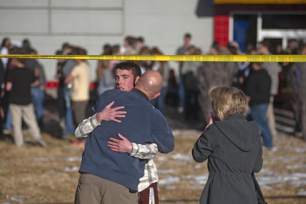 Students reunite with their families after a student opened fire at Arapahoe High School. Photo: Reuters