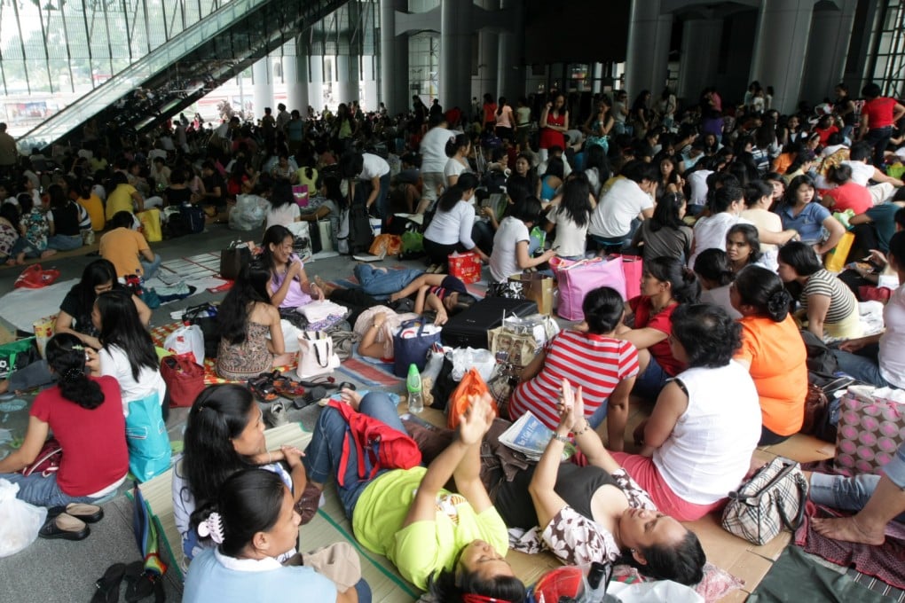 Domestic helpers gather in Central to enjoy their day off. Photo: David Wong