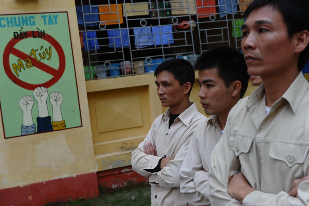 Drug addict inmates watch a music concert named "Bringing music into hospitals" on the World Aids Day at an official center for treatment of drug addicts in Hanoi in 2013. Photo: AFP