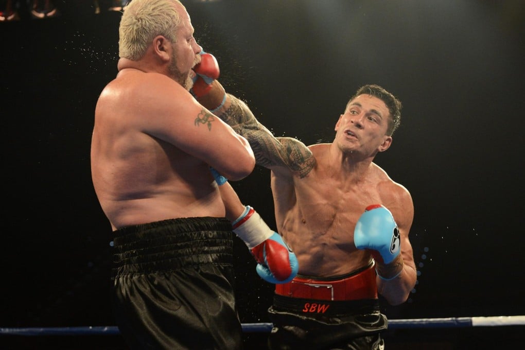 Sonny Bill Williams hits Francois Botha during their heavyweight world title bout. Photo: EPA