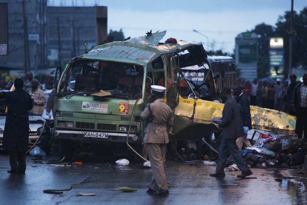 Kenyan security officials inspect the scene of an explosion in Nairobi. Photo: EPA