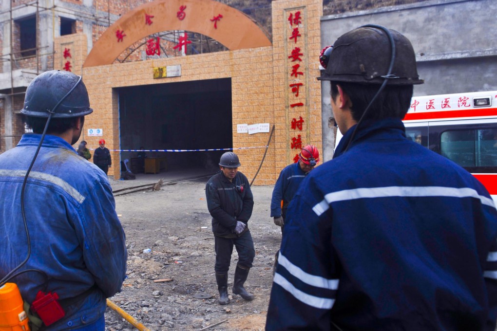 Miners wait at the entrance to the Baiyanggou coal mine after a gas explosion that killed 21. Photo: AP