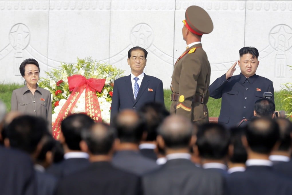 North Korean leader Kim Jong-un salutes as an honour guard marches past, while his aunt Kim Kyong-hui and Premier Pak Pong-ju watch during a ceremony in Pyongyang. Photo: Reuters