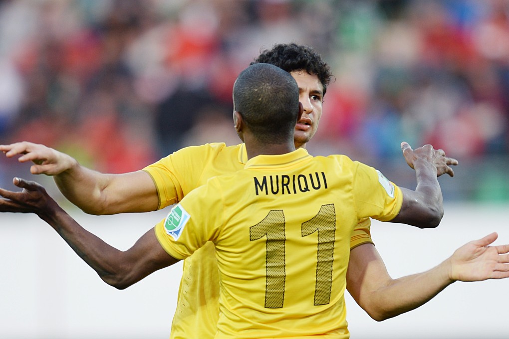 Guangzhou Evergrande's Elkeson celebrates his goal with Muriqui during their Club World Cup match against Egypt's Al Ahly  in Agadir, Morocco. Photo: Xinhua