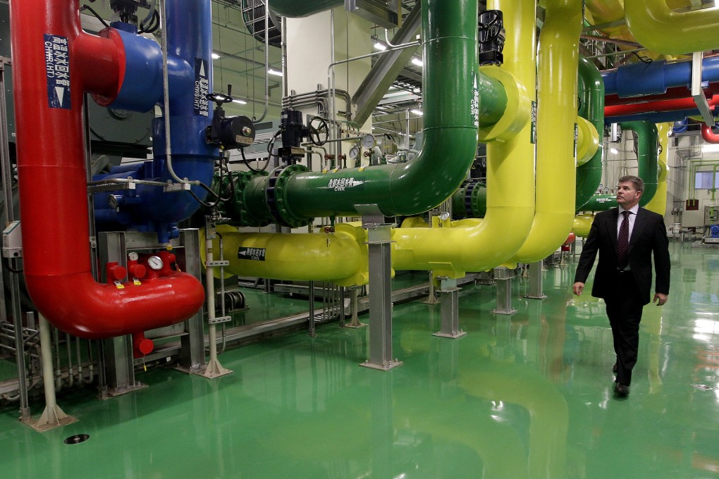 A Google official walks past a cooling system at the company's data centre in Taiwan. The internet giant's abandonment of a data centre project in Hong Kong has failed to deter locally listed SuneVision from its own billion-dollar plan. Photo: Reuters