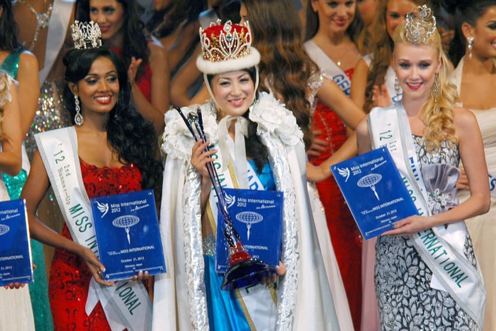 Ikumi Yoshimatsu, centre, wins the 2012 Miss International title