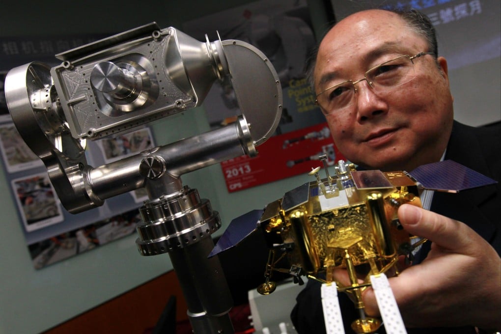 Professor Yung Kai-leung with his Camera Pointing System, which has proved instrumental to China's lunar landing. Photo: Dickson Lee