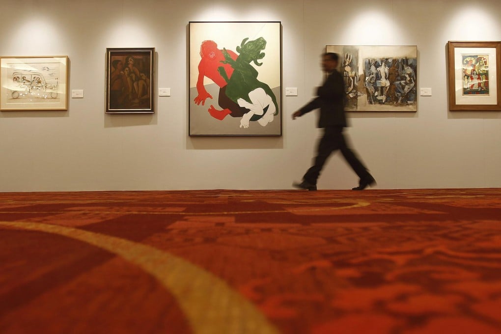 The sale of 83 paintings will be led by modern master Tyeb Mehta's workMahishasura(centre), which is predicted to sell for 75 million rupees to 95 million rupees. Photo: Reuters