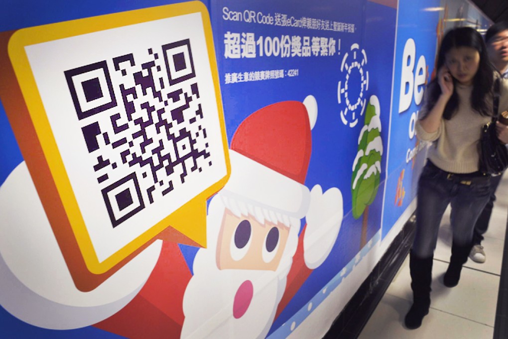 The crossover of various advertising media is slowly taking shape in Hong Kong with the growing use of QR code. Photo: Warton Li