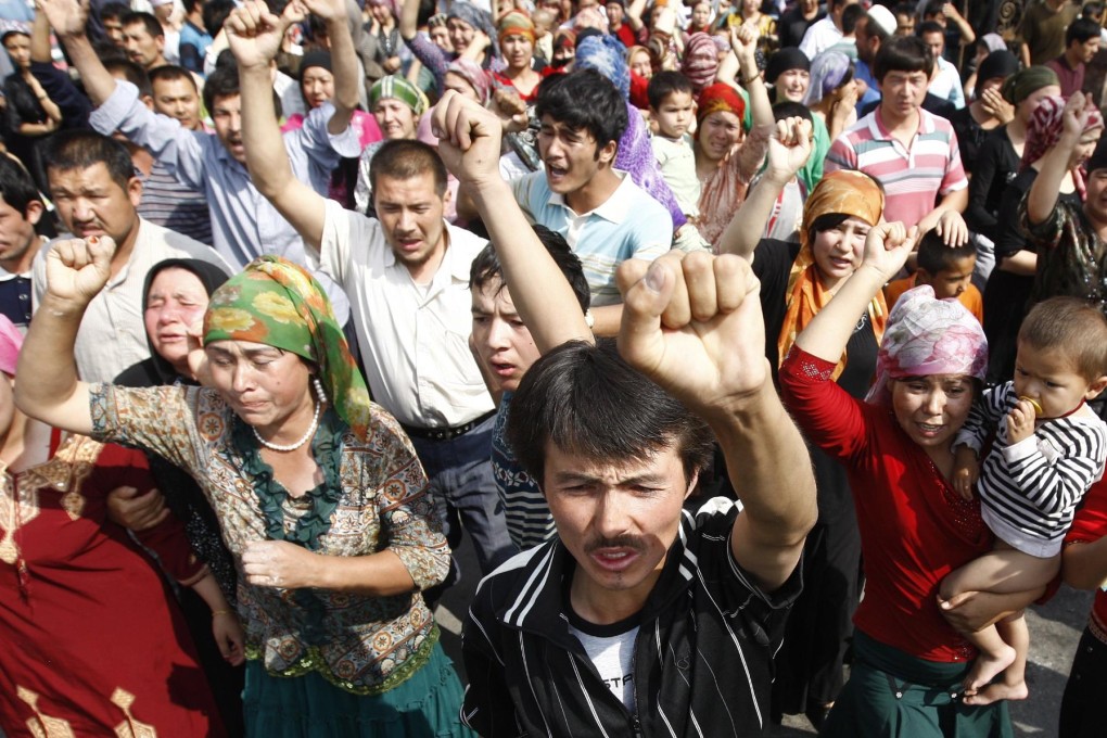 In this 2009 photo, Uyghurs are pictured protesting in the Xinjiang capital of Urumqi. Members of the ethnic minority were confirmed to be part of the mob that attacked police officers with explosives and knives on Sunday. Photo: EPA