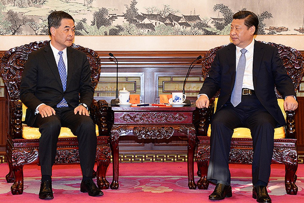 Leung Chun-ying briefs President Xi Jinping in Beijing yesterday on the latest developments in Hong Kong. Photo: SCMP