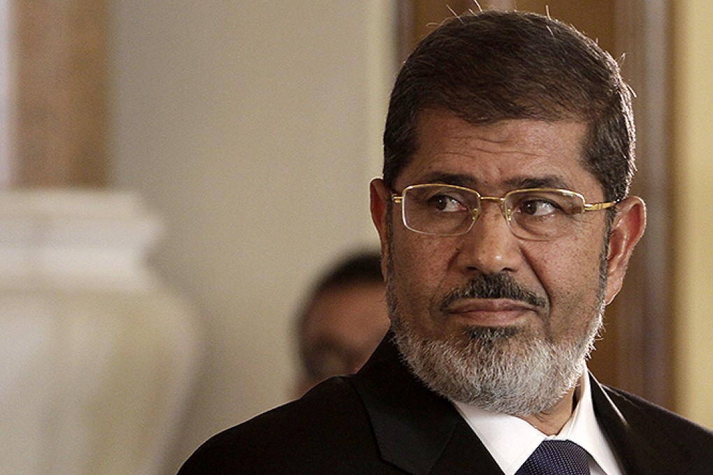 Former Egyptian President Mohammed Mursi is already standing trial for inciting violence during protests outside the presidential palace a year ago. Photo: Reuters