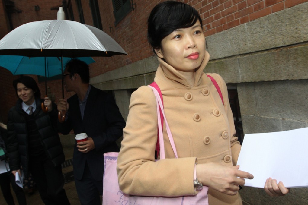 SoCO community officer Sze Lai-shan leaves Court of Final Appeal in Central after the court ruled that the requirement for social security applicants to have stayed in Hong Kong for seven years is unconstitutional. Photo: Sam Tsang