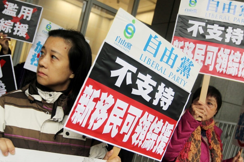Members of Liberal Party stage a protest against the abuse of Comprehensive Social Security Assistance after Court of Final Appeal ruled he government's policy of excluding new immigrants from its welfare programme is unconstitutional. Photo: Sam Tsang
