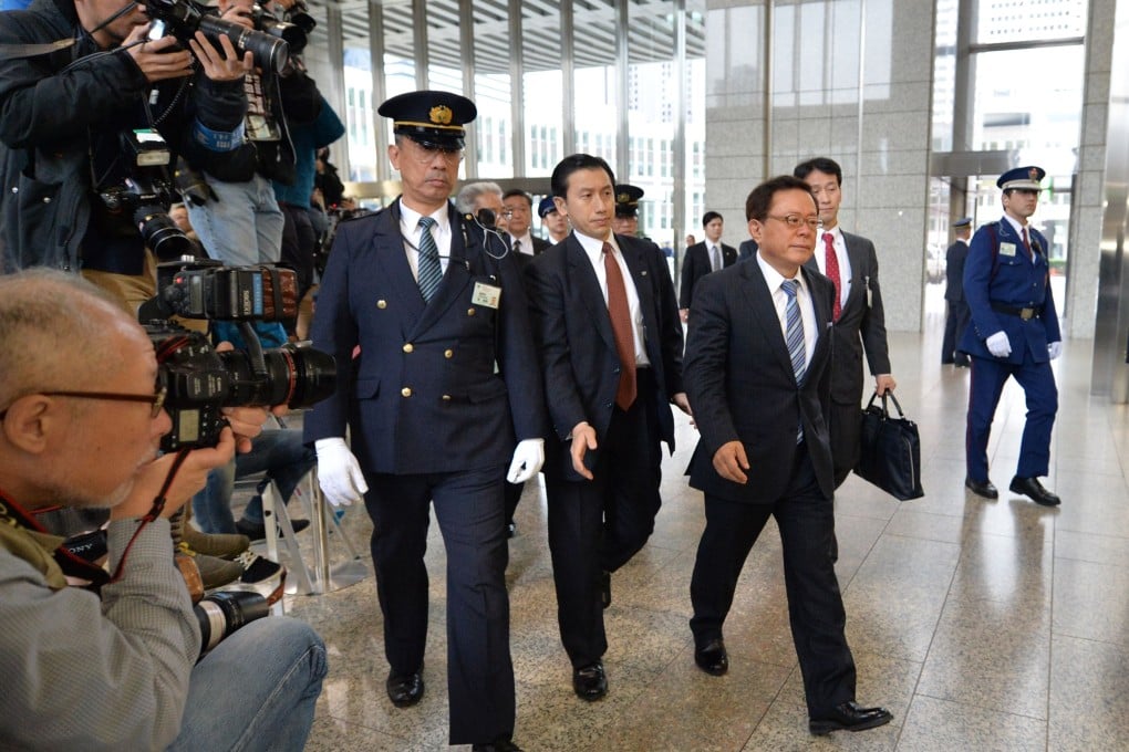 Tokyo governor Naoki Inose (front right) has resigned after admitted receiving US$500,000 from a hospital tycoon. Photo: AFP