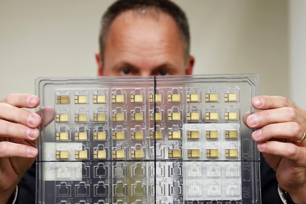 U.S. government's chief law enforcement officer displays a set of confiscated American-made radiation-hardened microchips, which were seized from a Chinese national who tried to smuggle them to China. Photo: Reuters