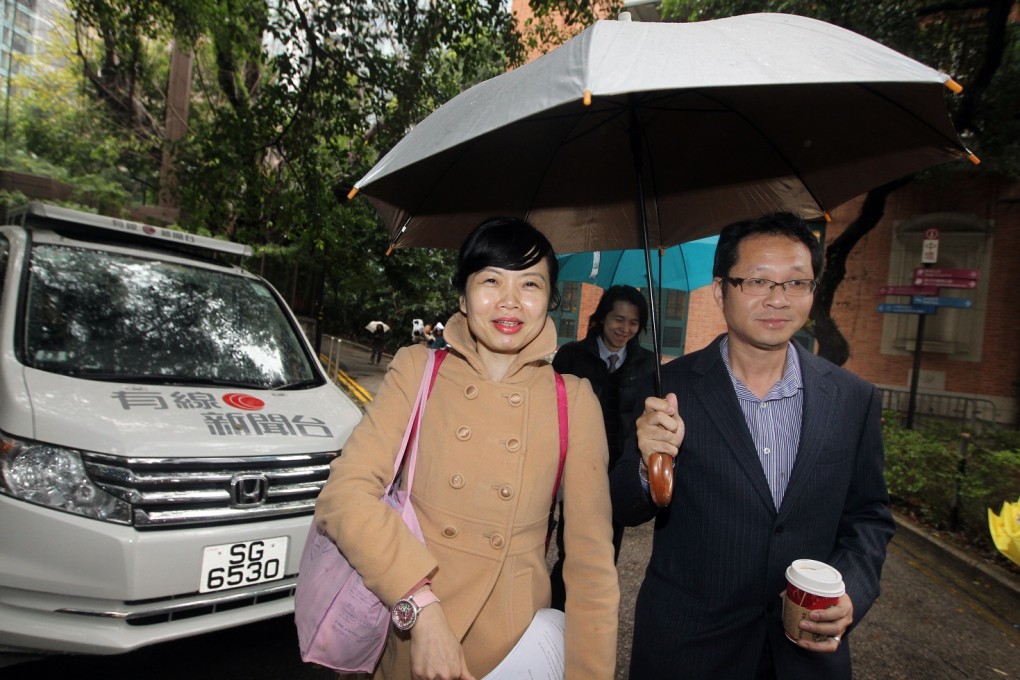 SoCo community officer Sze Lai-shan and Richard Tsoi Yiu-Cheong of Democratic Party leave Court of Final Appeal on December 17, 2013 after the court ruled that the requirement for social security applicants to have stayed in Hong Kong for seven years is unconstitutional. Photo: SCMP/Sam Tsang